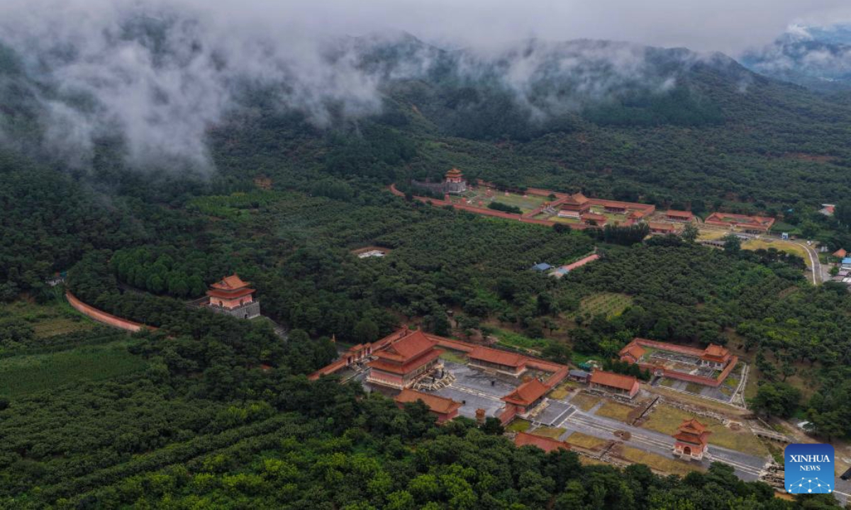 An aerial drone photo taken on Aug. 5, 2025 shows the scenery of mist-shrouded eastern royal tombs of the Qing Dynasty (1644-1911) in Zunhua City, north China's Hebei Province. (Photo by Liu Mancang/Xinhua)