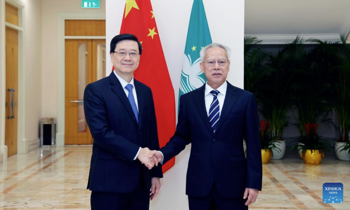 Sam Hou Fai (R), chief executive of China's Macao Special Administrative Region (SAR), meets with John Lee, chief executive of the Hong Kong Special Administrative Region, at the government headquarters of the Macao SAR in Macao, south China, Aug. 5, 2025. (Xinhua)