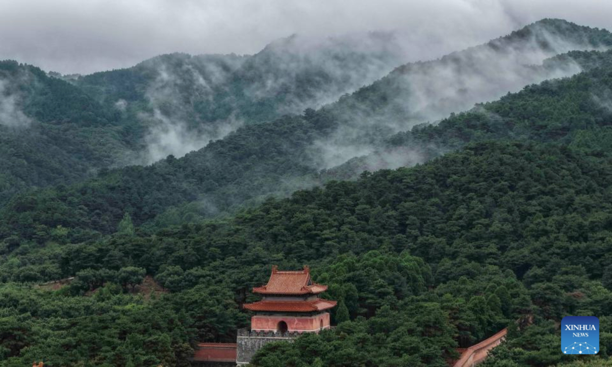 An aerial drone photo taken on Aug. 5, 2025 shows the scenery of mist-shrouded eastern royal tombs of the Qing Dynasty (1644-1911) in Zunhua City, north China's Hebei Province. (Photo by Liu Mancang/Xinhua)