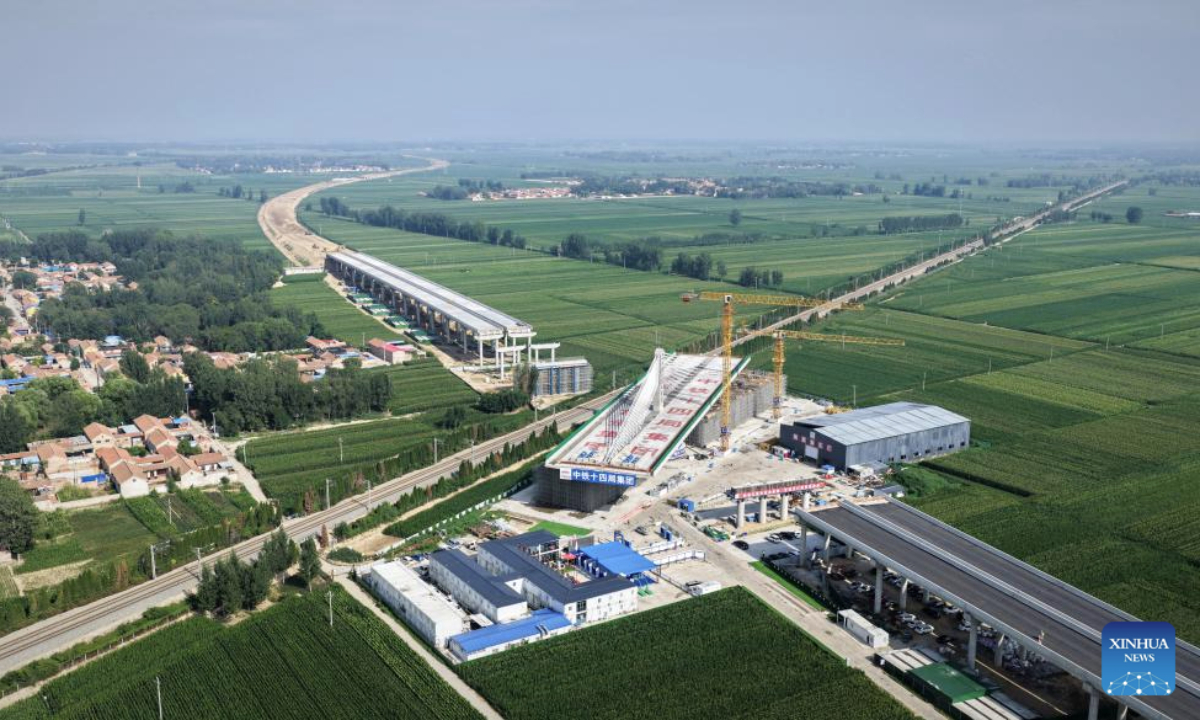 An aerial drone photo taken on Aug. 6, 2025 shows a cable-stayed bridge before its rotation in Dezhou, east China's Shandong Province. A 23,500 tonnes cable-stayed bridge, part of the highway linking Dezhou of east China's Shandong Province and Shangrao of east China's Jiangxi Province, was rotated to its target position on Wednesday. (Photo by Wang Guansheng/Xinhua)