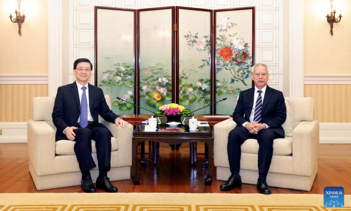 Sam Hou Fai (R), chief executive of China's Macao Special Administrative Region (SAR), meets with John Lee, chief executive of the Hong Kong Special Administrative Region, at the government headquarters of the Macao SAR in Macao, south China, Aug. 5, 2025. (Xinhua)