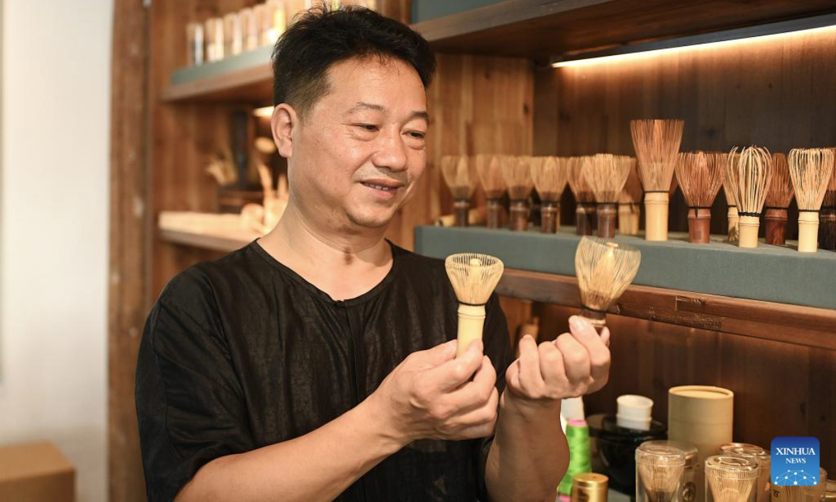 Chen Jinxin, an inheritor of tea whisk making technique, shows handmade tea whisks at Jingshan Village in Yuhang District of Hangzhou City, east China's Zhejiang Province, Aug. 5, 2025. Jingshan Village, located in Yuhang District of Hangzhou City, east China's Zhejiang Province, is celebrated for its top-notch forest coverage rate of over 96 percent.

In recent years, the village has been boosting coordinated development of its tea industry and tourist service through creative projects such as digital tea gardens and low-carbon homestays, aiming to convert ecological advantages into economic propellers. (Xinhua/Mao Zhu)