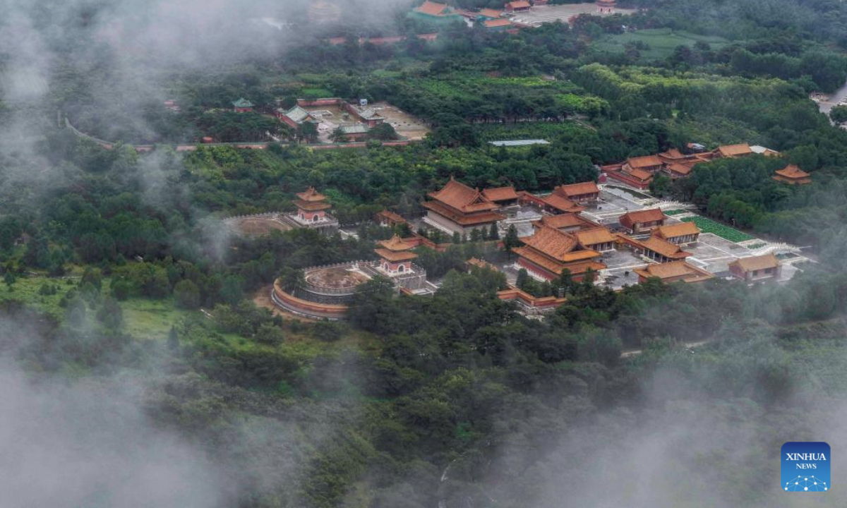 An aerial drone photo taken on Aug. 5, 2025 shows the scenery of mist-shrouded eastern royal tombs of the Qing Dynasty (1644-1911) in Zunhua City, north China's Hebei Province. (Photo by Liu Mancang/Xinhua)