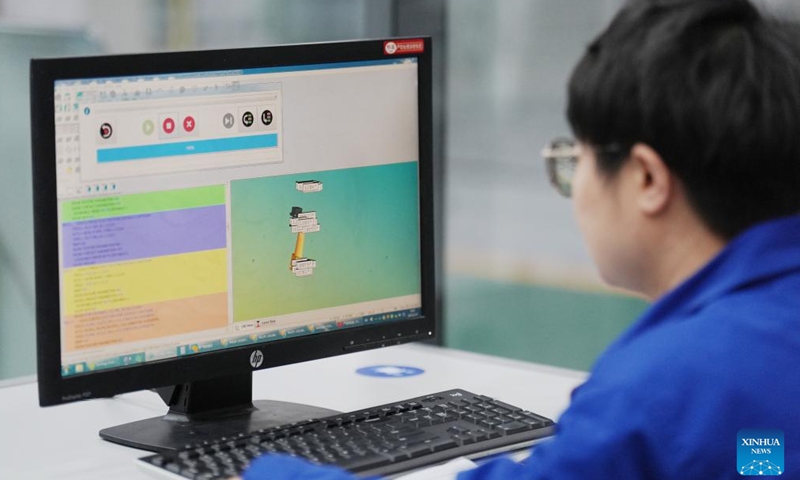 An engineer reviews turbine blade data at a coordinate measuring machine laboratory of Harbin Turbine Co., Ltd. in Harbin northeast China's Heilongjiang Province, Feb. 26, 2025. (Xinhua/Wang Song)