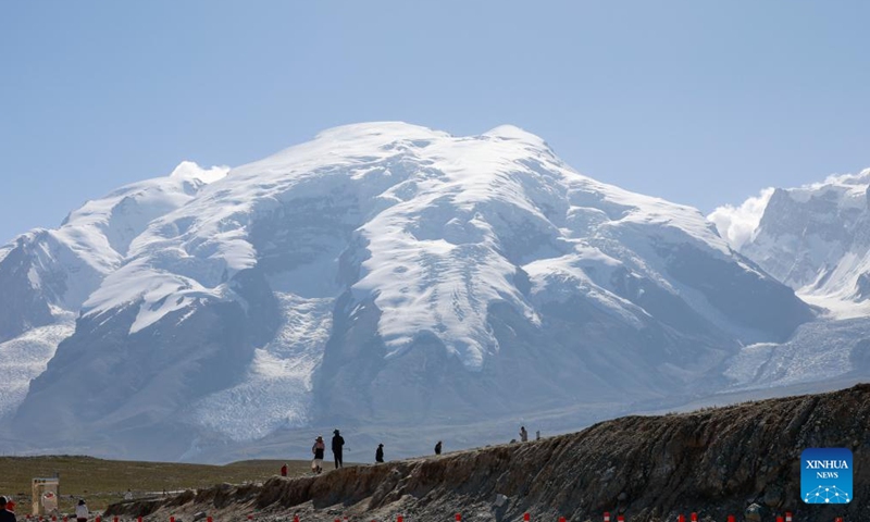 People visit the Muztagata glacier park in Tajik Autonomous County of Taxkorgan, northwest China's Xinjiang Uygur Autonomous Region, Aug. 3, 2025. Tajik Autonomous County of Taxkorgan has entered the peak travel season as more tourists come here to experience the culture and enjoy the scenery on the plateau. (Xinhua/Wang Fei)