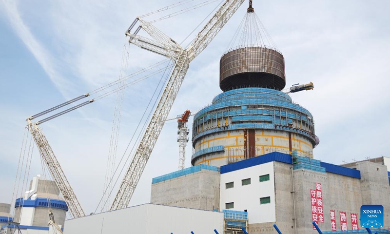A crane lifts the CB20 module of the nuclear island for the 3rd unit of the Haiyang Nuclear Power Plant in Haiyang, east China's Shandong Province, Aug. 4, 2025. The CB20 module was successfully lifted and positioned on Monday, marking the completion of all major module installations for the 3rd unit of the Haiyang Nuclear Power Plant and the start of equipment installation and commissioning phase. (Photo by Tang Ke/Xinhua)