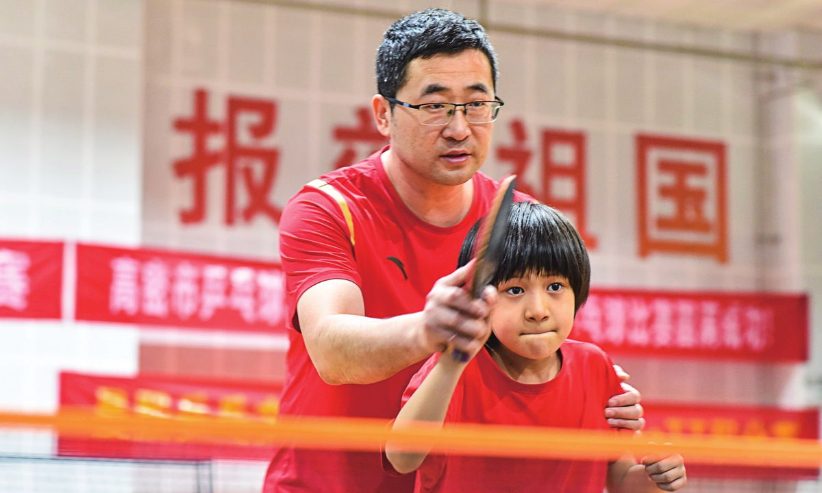 A table tennis coach trains a student in Weifang, East China's Shandong Province, on July 19, 2025. Photo: VCG