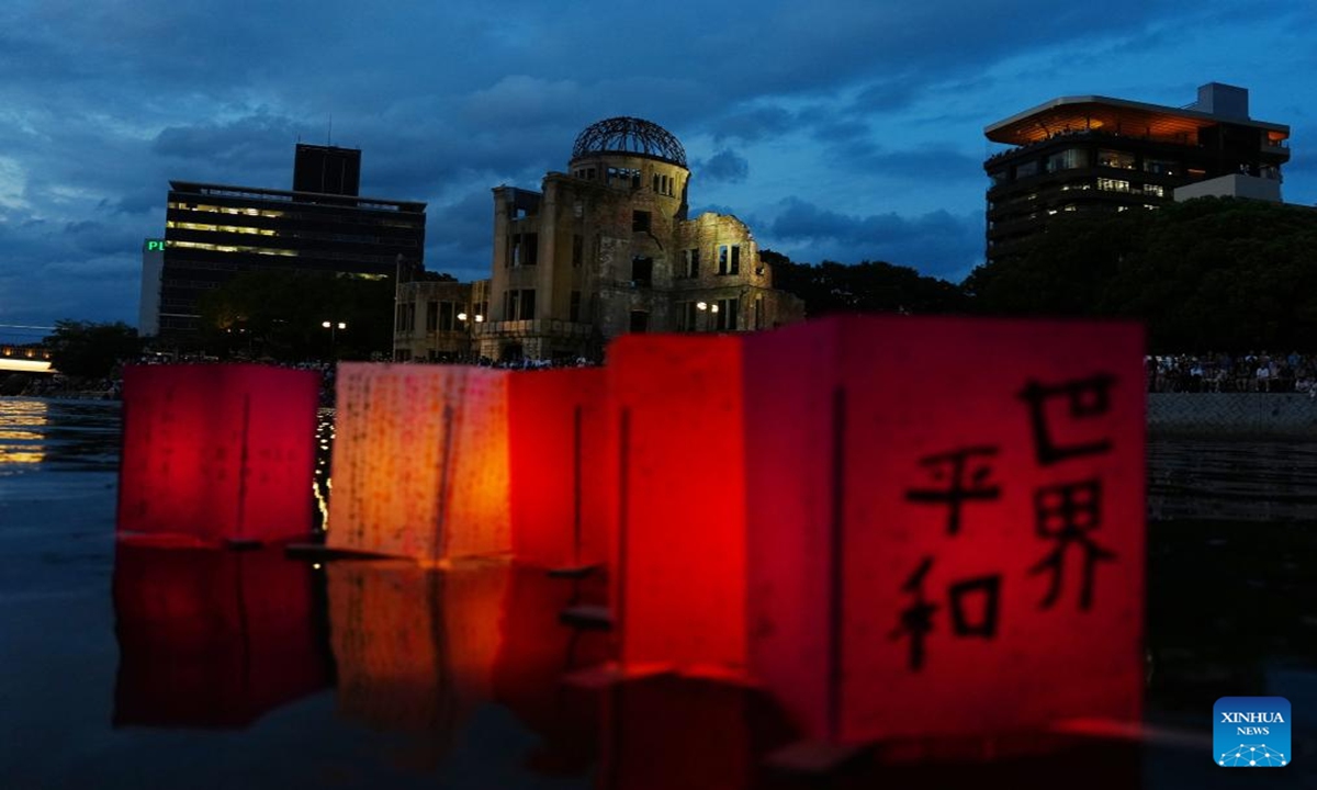 Paper lanterns are seen floating on a river at Hiroshima Peace Memorial Park in Hiroshima, Japan, on Aug. 6, 2025. Photo: Xinhua