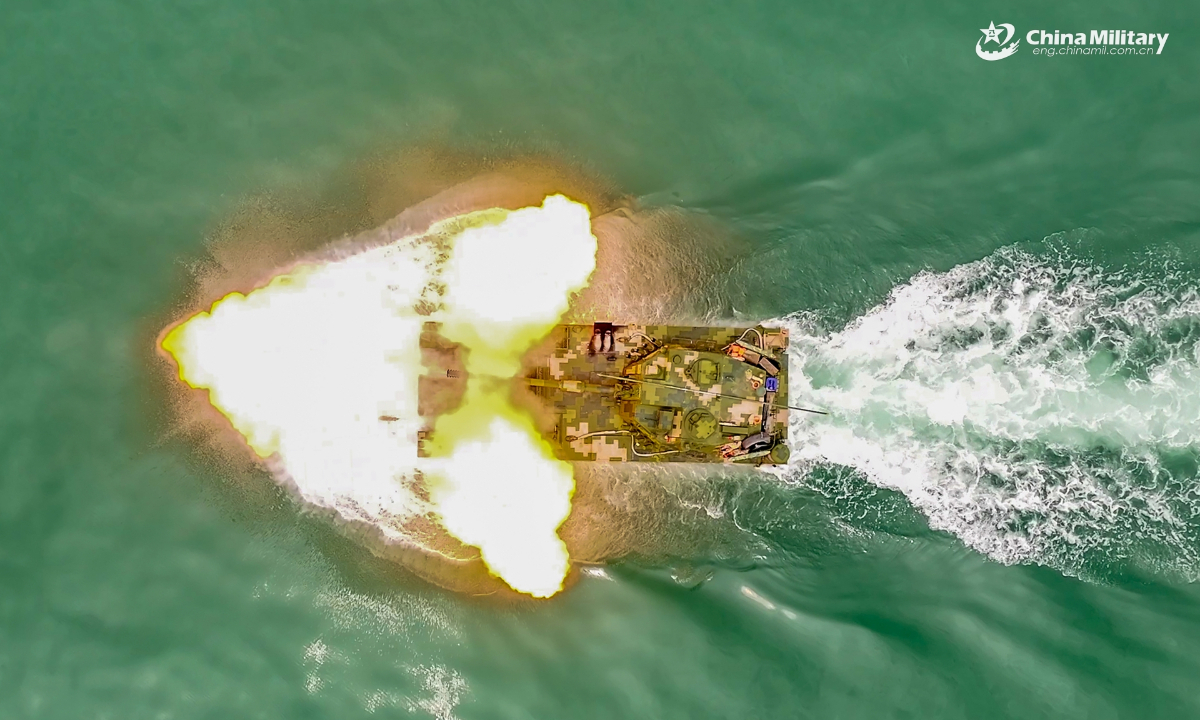 An amphibious assault vehicle attached to an amphibious armored vehicle detachment of a brigade under the PLA Army fires at target during a maritime shooting training exercise on July 13, 2025. (eng.chinamil.com.cn/Photo by Zeng Bingyang)