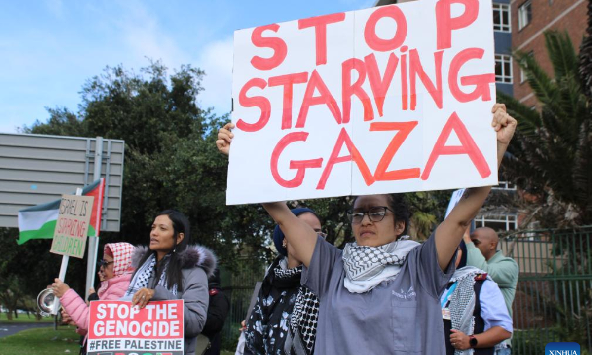 Healthcare workers protest Israel's weaponization of hunger and mass starvation in Gaza, in Cape Town, South Africa, on Aug. 7, 2025. South African healthcare workers from both public and private hospitals nationwide took part in the protest on Thursday. (Photo by Shakirah Thebus/Xinhua)