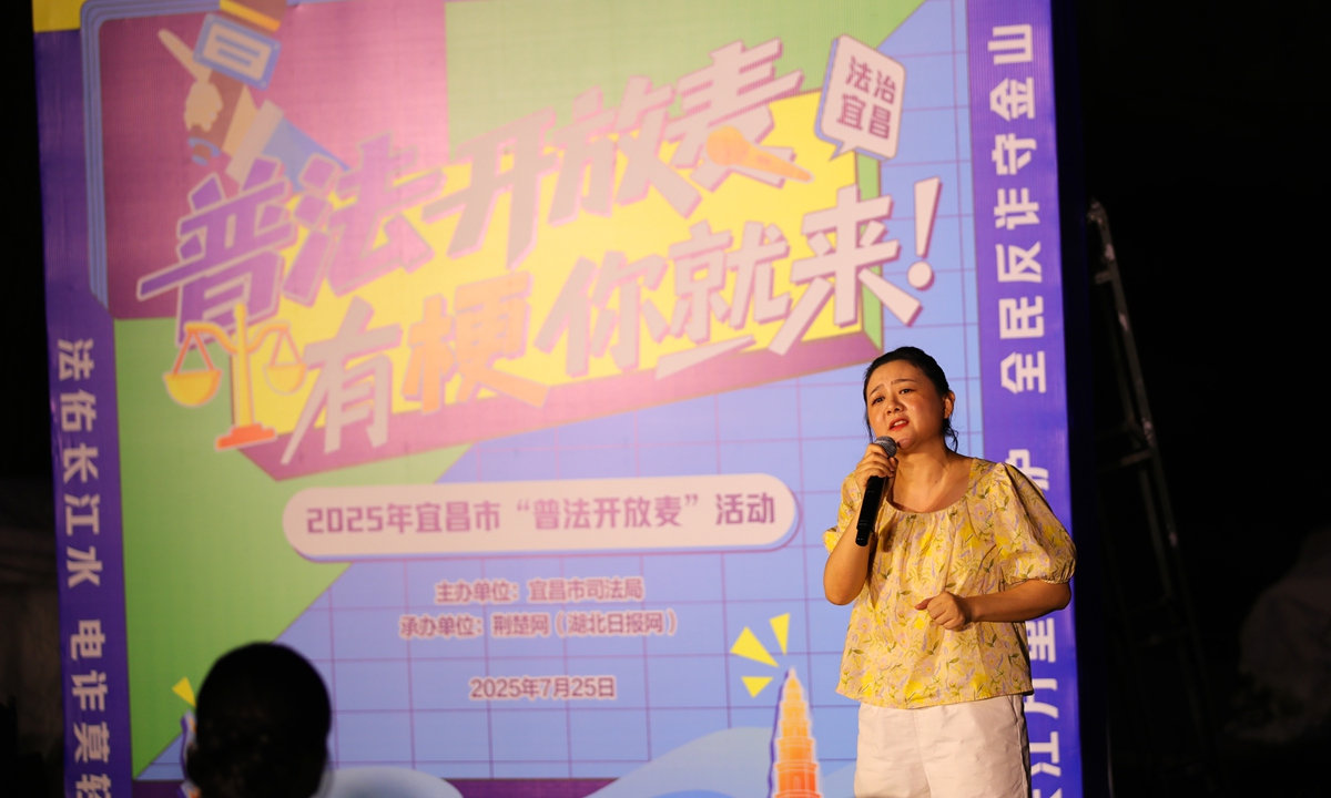 A female stand-up comedian performs at a 