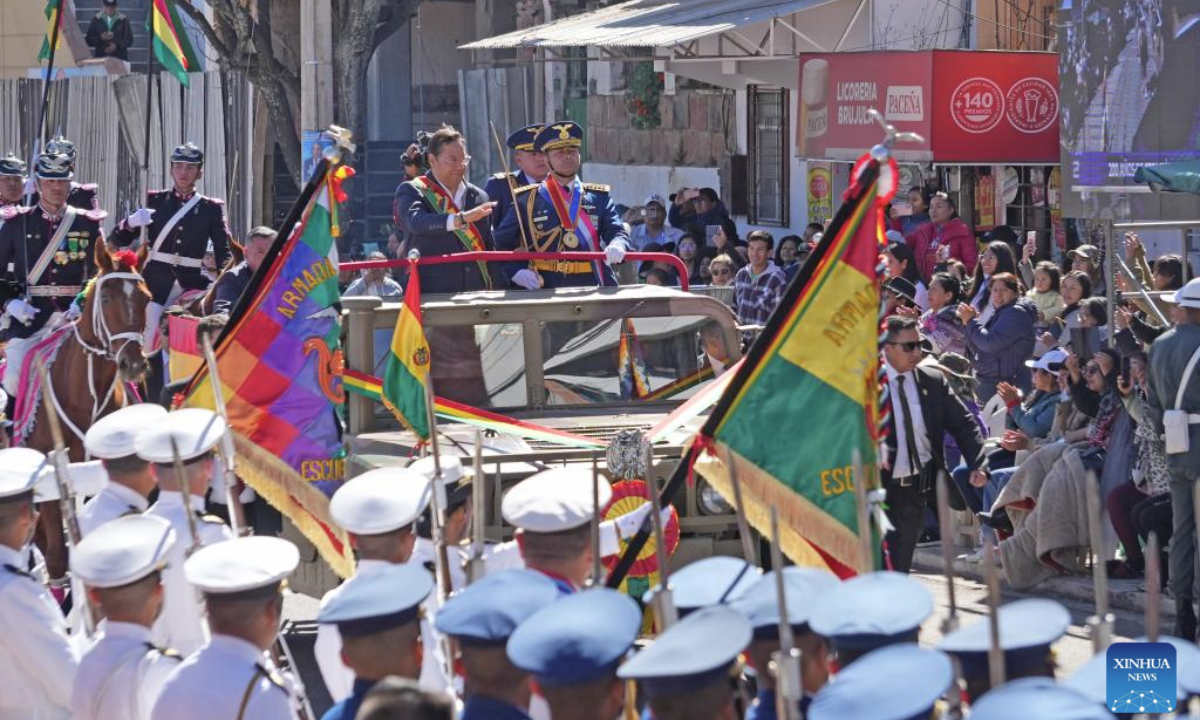 Bolivian President Luis Arce (L, Front, in the vehicle) reviews the troops during a parade to commemorate the Bolivian Armed Forces Day in Sucre, Bolivia, on Aug. 7, 2025. (Photo by Javier Mamani/Xinhua)