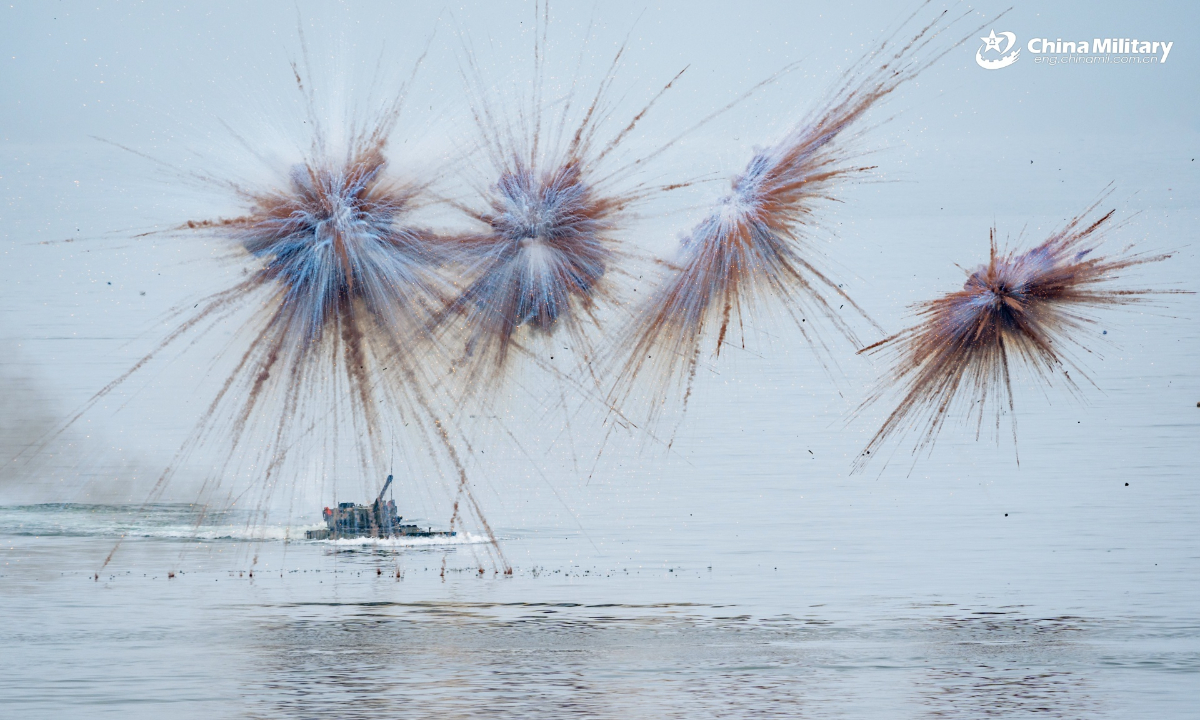 An amphibious assault vehicle attached to an amphibious armored vehicle detachment of a brigade under the PLA Army fires smoke bomb during a maritime shooting training exercise on July 13, 2025. (eng.chinamil.com.cn/Photo by Zeng Bingyang)