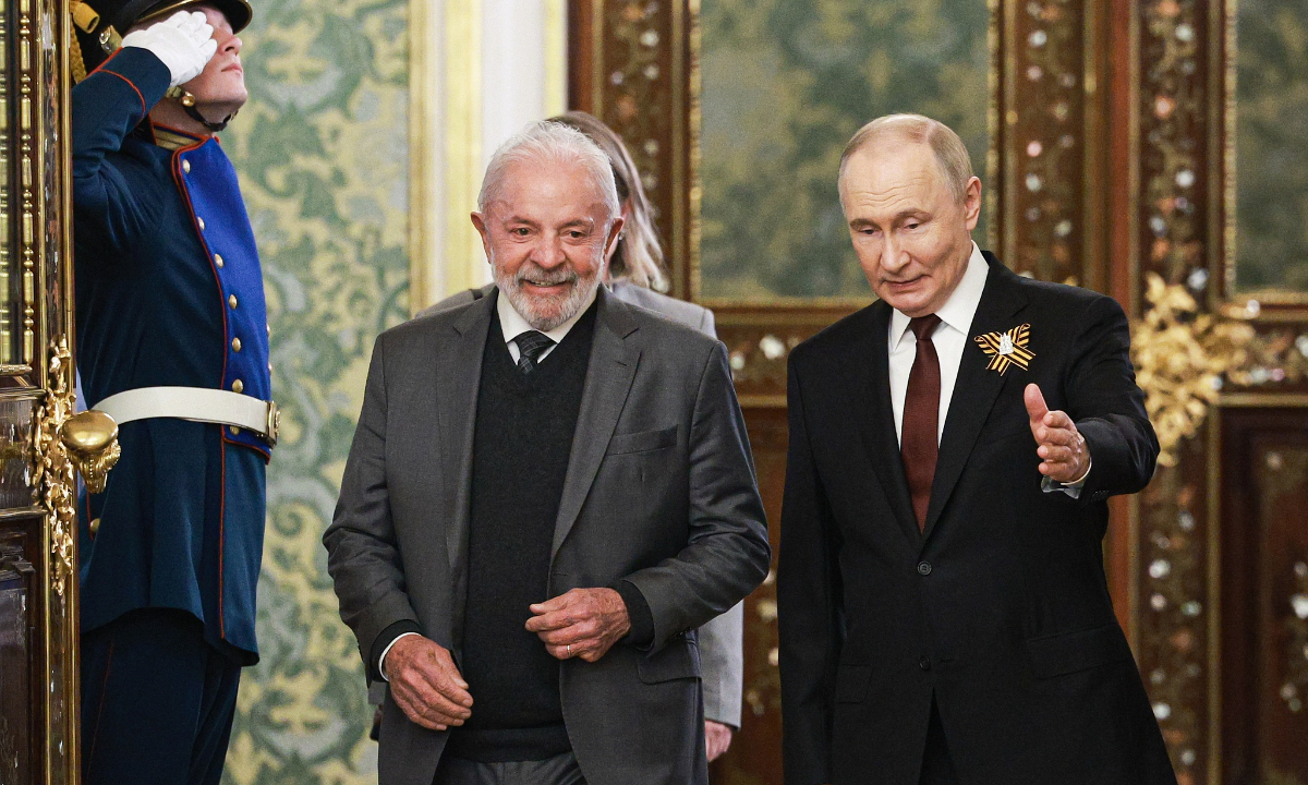 Vladimir Putin, President of Russia, and his Brazilian counterpart Luiz Inacio Lula da Silva (R-L) arrive for a bilateral meeting at the Moscow Kremlin. Alexander Shcherbak/TASS