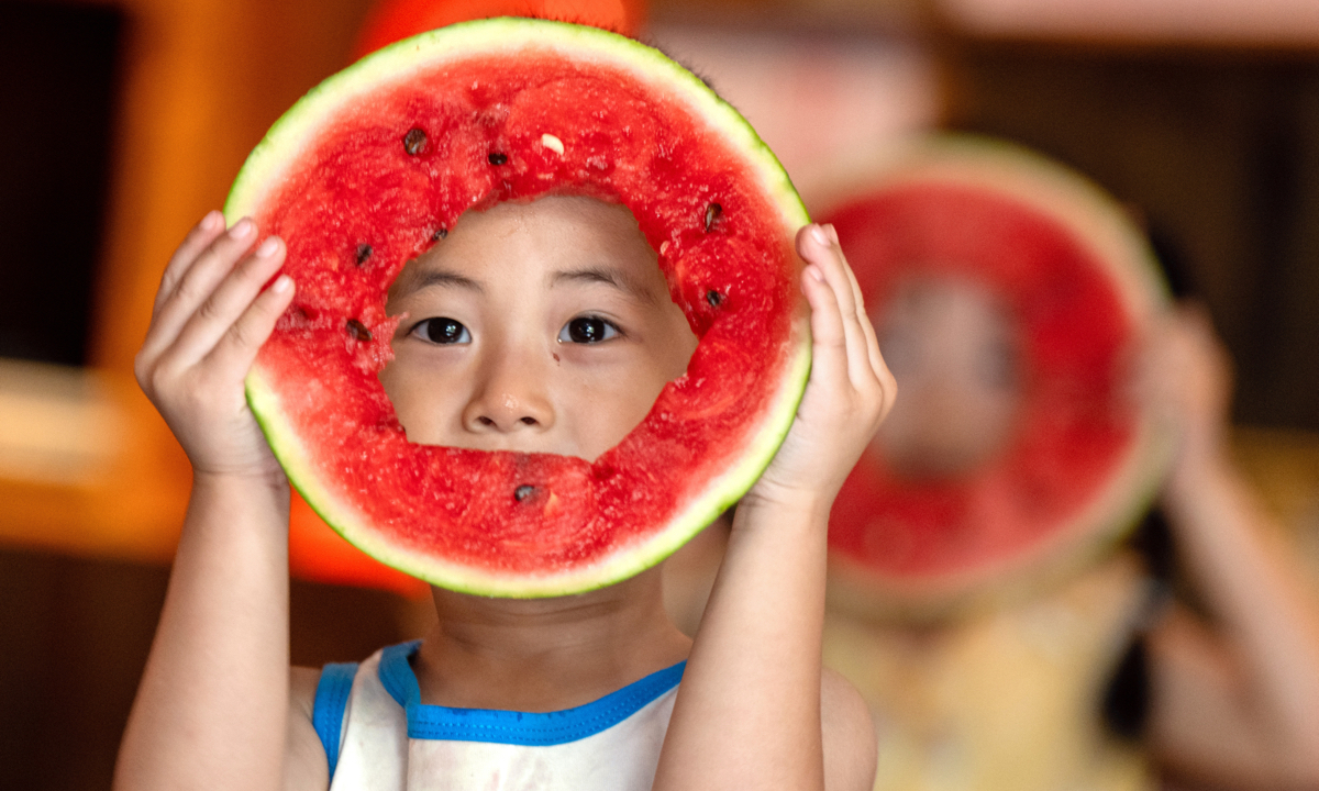 Ahead of “Liqiu,” the beginning of autumn on the Chinese lunar calendar which falls on August 7 this year, a child in Changxing County, Huzhou, East China’s Zhejiang Province, eats watermelon to celebrate the festival on August 6, 2025. Photo: VCG