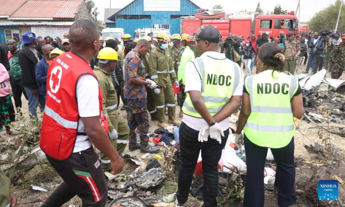 Rescuers work at the site of a plane crash in the Mwihoko area, on the outskirts of Nairobi, Kenya, on Aug. 7, 2025. At least six people were confirmed dead and two others injured after a light aircraft belonging to AMREF Flying Doctors crashed in the residential area on the outskirts of Nairobi, a government official confirmed. (Photo by John Okoyo/Xinhua)