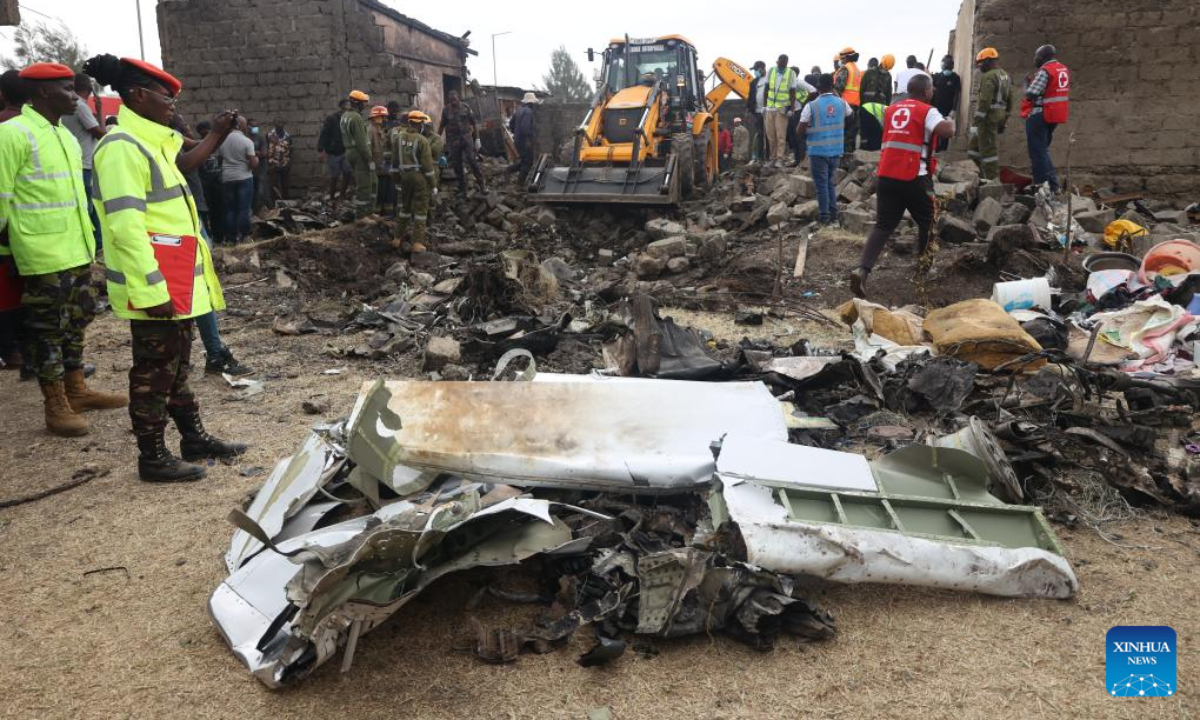 Rescuers work at the site of a plane crash in the Mwihoko area, on the outskirts of Nairobi, Kenya, on Aug. 7, 2025. At least six people were confirmed dead and two others injured after a light aircraft belonging to AMREF Flying Doctors crashed in the residential area on the outskirts of Nairobi, a government official confirmed. (Photo by John Okoyo/Xinhua)