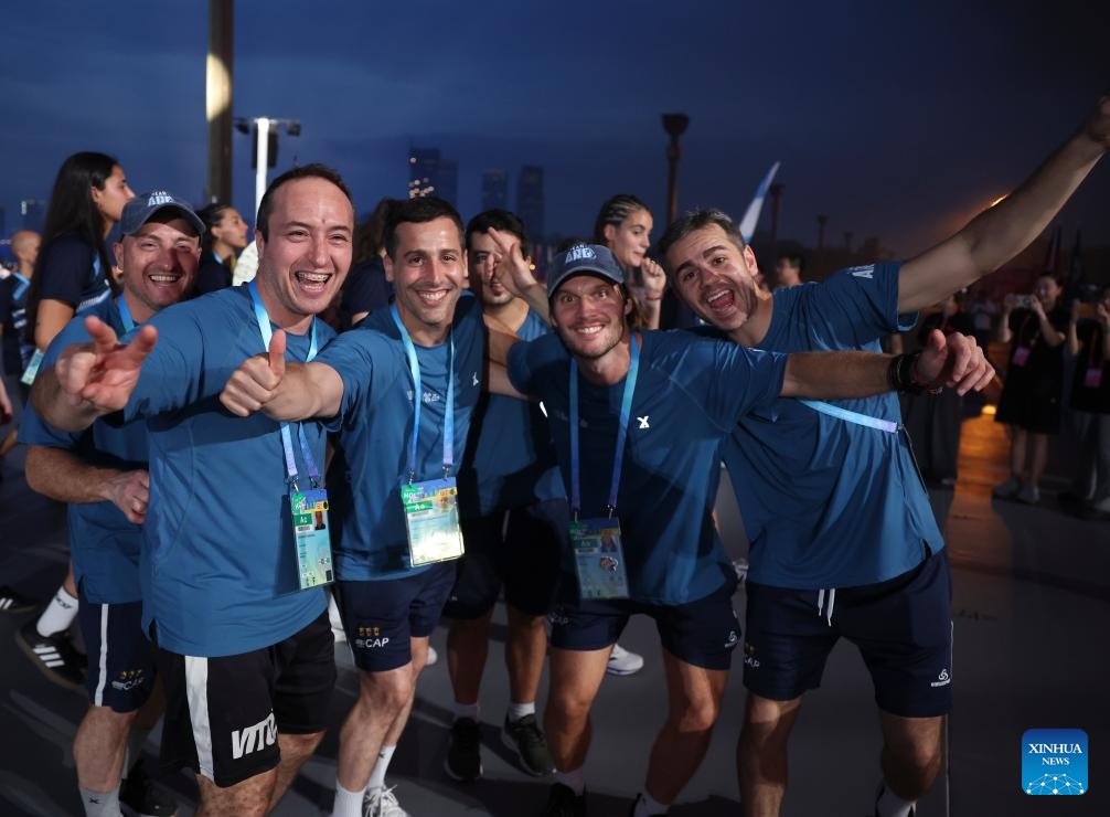 Members of the delegation of Argentina take photos during the opening ceremony of the World Games 2025 in Chengdu, southwest China's Sichuan Province, on Aug. 7, 2025. (Photo: Xinhua)