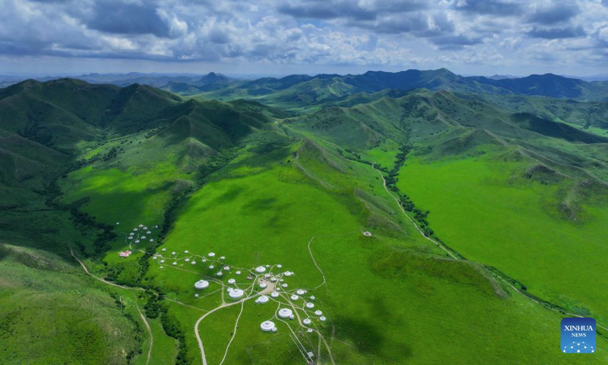 An aerial drone photo taken on July 28, 2025 shows a view of the grassland in Jarud Banner of Tongliao City, north China's Inner Mongolia Autonomous Region. The grassland, located in the northwest of Tongliao and at the south foot of the Greater Khingan Mountains, presents picturesque scenery during the rainy seasons. (Xinhua/Lian Zhen)