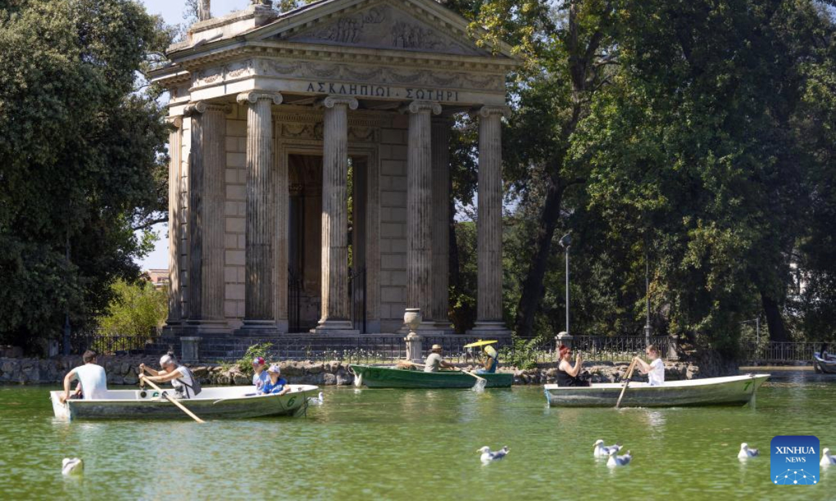 Tourists row boats on the lake in Villa Borghese in Rome, Italy, Aug. 7, 2025. Italians enjoy various activities during the summer holiday season. (Xinhua/Li Jing)