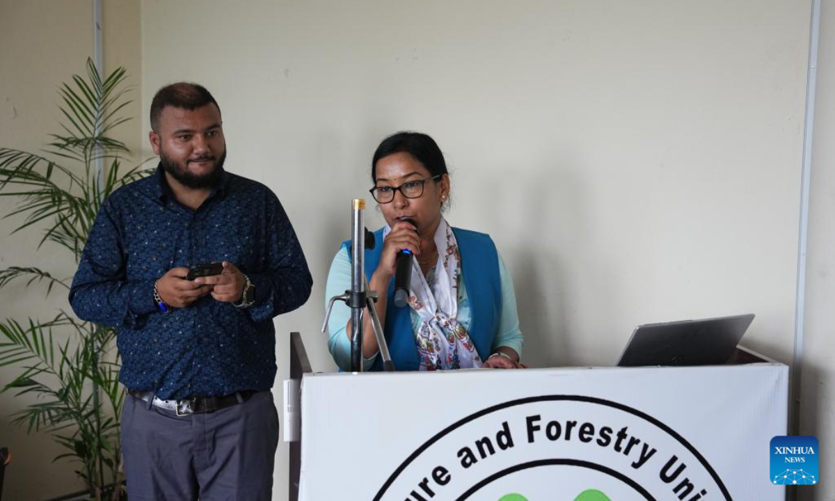Mayor of Bharatpur Renu Dahal speaks at the inauguration ceremony of the transplant of experimental seedlings of hybrid rice varieties at the Nepal South Agricultural Science and Technology Park in Bharatpur, Nepal, Aug. 11, 2025. Experimental seedlings of hybrid rice varieties were transplanted into Nepal South Agricultural Science and Technology Park on Monday, as part of efforts to help the South Asian country achieve food self-sufficiency. (Xinhua)