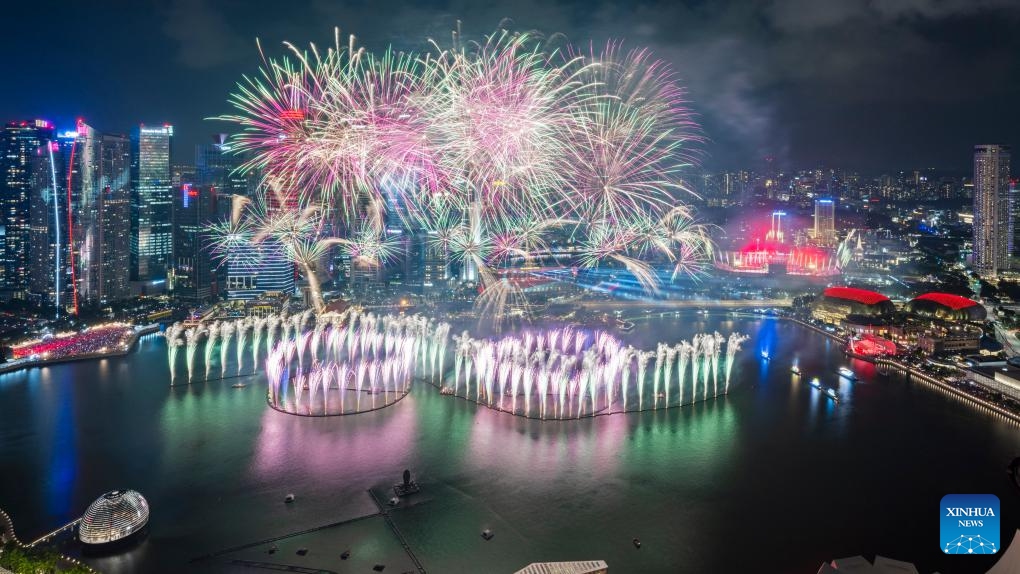 Fireworks light up the sky over Marina Bay during the National Day celebrations in Singapore, on Aug. 9, 2025. Singapore celebrated the 60th anniversary of its independence on Saturday. (Photo by Then Chih Wey/Xinhua)