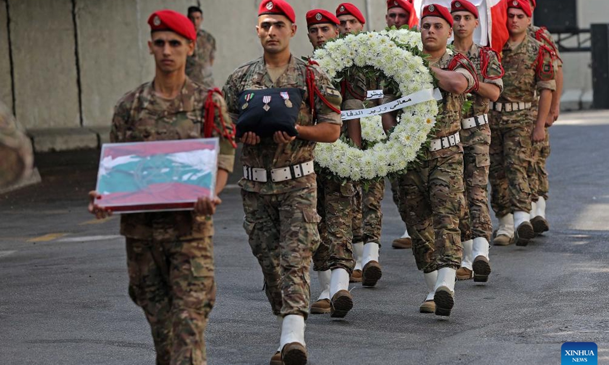 This photo taken on Aug. 10, 2025 shows the Lebanese army holding a mourning ceremony for one of the six soldiers killed in the explosion of an arms depot in the city of Tyre, in front of a military hospital in Beirut, Lebanon. Six Lebanese Army soldiers were killed and an unspecified number of others injured on Saturday when a weapons depot exploded during an inspection and dismantling operation carried out by an army unit in the city of Tyre, southern Lebanon. (Photo by Bilal Jawich/Xinhua)