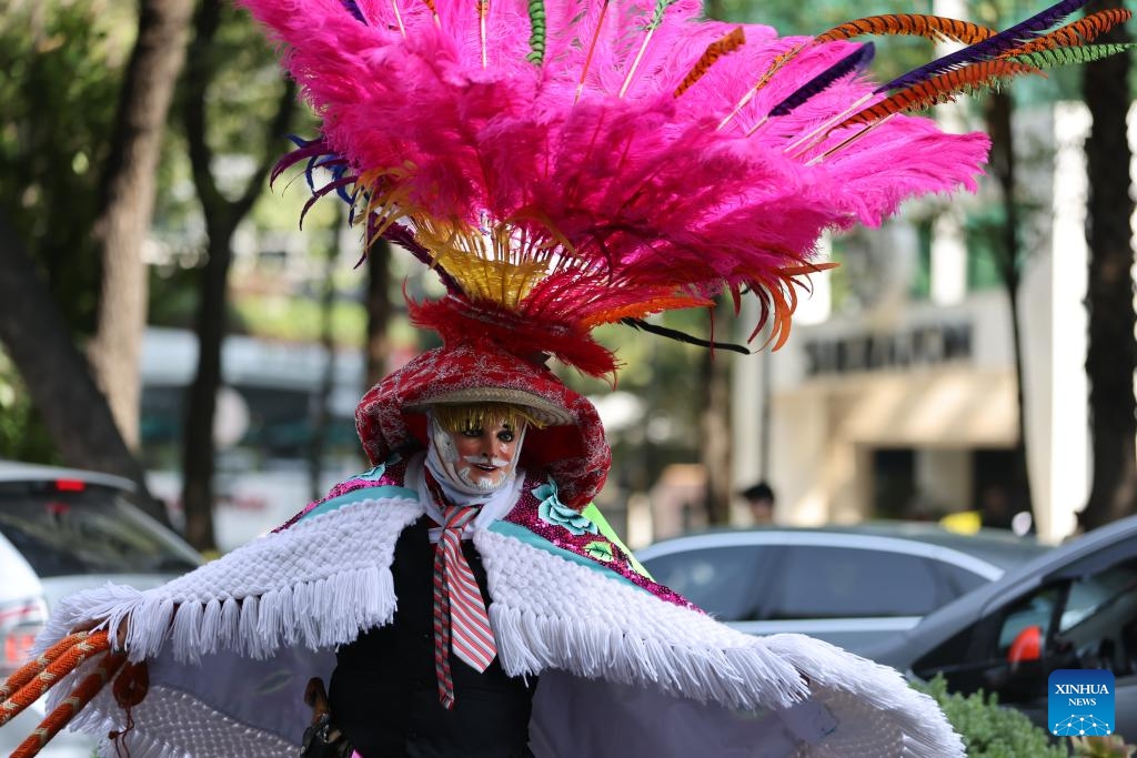 An actor in traditional costume is pictured during a parade in commemoration of the International Day of the World's Indigenous Peoples in Mexico City, Mexico, Aug. 9, 2025. The International Day of the World's Indigenous Peoples is marked annually on Aug. 9, with this year's theme being Indigenous Peoples and AI: Defending Rights, Shaping Futures. (Xinhua/Li Mengxin)