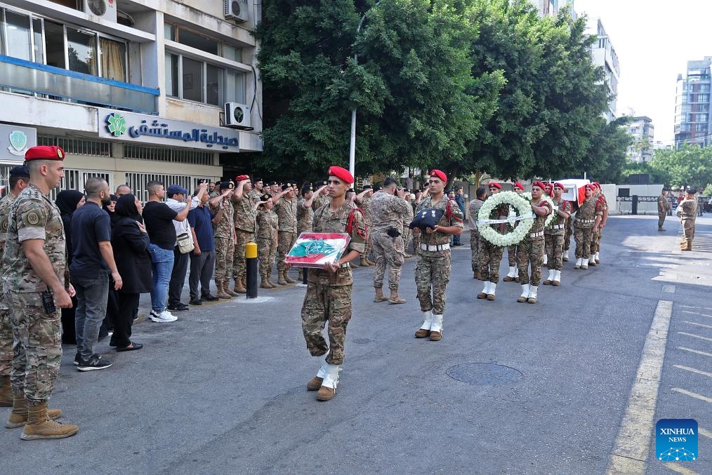 This photo taken on Aug. 10, 2025 shows the Lebanese army holding a mourning ceremony for one of the six soldiers killed in the explosion of an arms depot in the city of Tyre, in front of a military hospital in Beirut, Lebanon. Six Lebanese Army soldiers were killed and an unspecified number of others injured on Saturday when a weapons depot exploded during an inspection and dismantling operation carried out by an army unit in the city of Tyre, southern Lebanon. (Photo by Bilal Jawich/Xinhua)