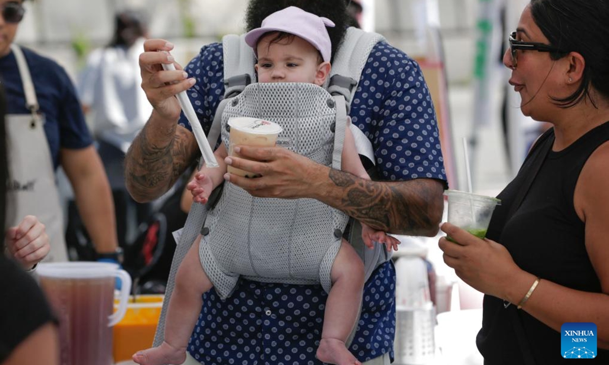 People enjoy bubble tea during the 2025 Bubble Tea Festival in Burnaby, British Columbia, Canada, on Aug. 10, 2025. The festival showcases over a hundred kinds of bubble tea, attracting bubble tea lovers to the event. (Photo by Liang Sen/Xinhua)