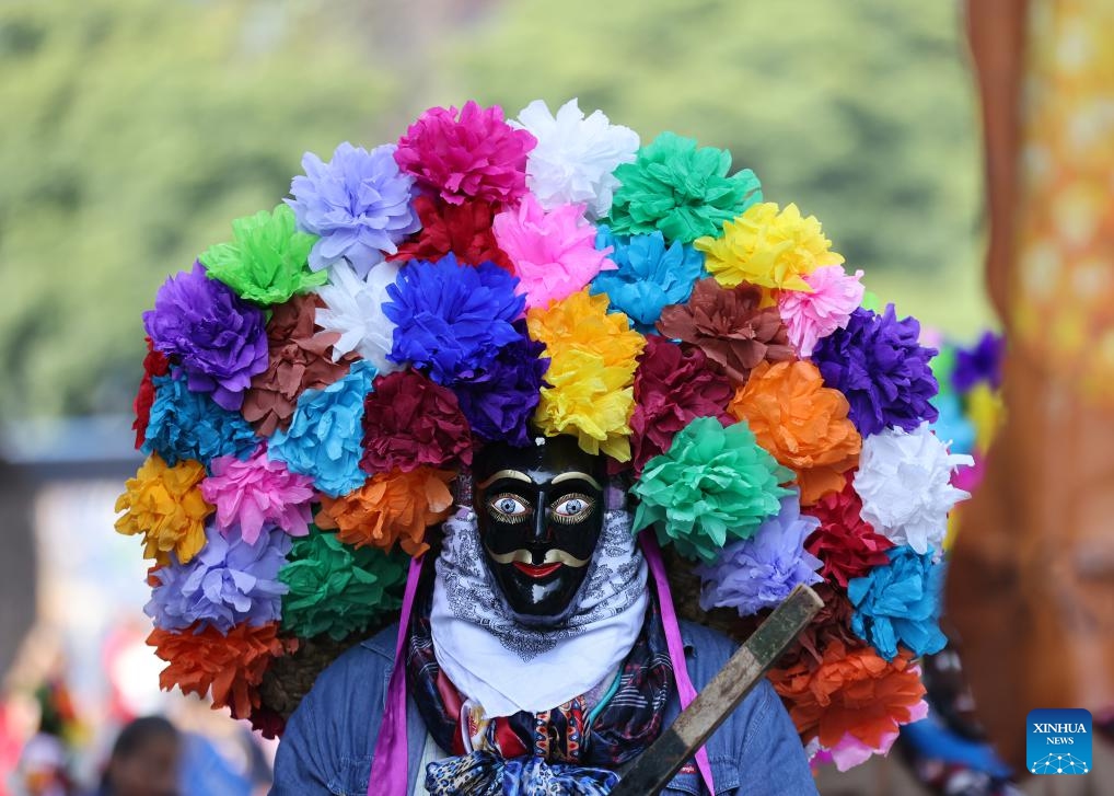 An actor in traditional costume is pictured during a parade in commemoration of the International Day of the World's Indigenous Peoples in Mexico City, Mexico, Aug. 9, 2025. The International Day of the World's Indigenous Peoples is marked annually on Aug. 9, with this year's theme being Indigenous Peoples and AI: Defending Rights, Shaping Futures. (Xinhua/Li Mengxin)