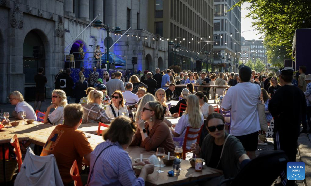 People watch a music performance during the Night of the Arts in Helsinki, Finland, Aug. 14, 2025. The event was held here on Thursday, featuring more than 370 free art and cultural activities, including music, dance, theater, painting, literature and other art forms. (Photo by Matti Matikainen/Xinhua)