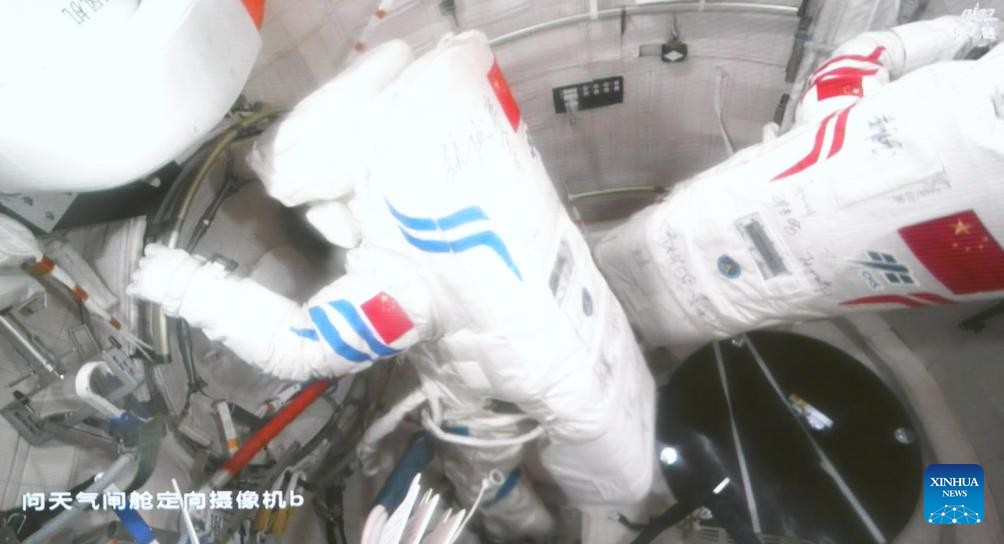 This screen image captured at Beijing Aerospace Control Center on Aug. 15, 2025 shows Shenzhou-20 astronauts Chen Dong (L) and Wang Jie preparing to leave China's orbiting space station for extravehicular activities. The Shenzhou-20 crew aboard China's orbiting space station completed their mission's third series of extravehicular activities on Friday, according to the China Manned Space Agency (CMSA).(Xinhua/Li Yanchen)
