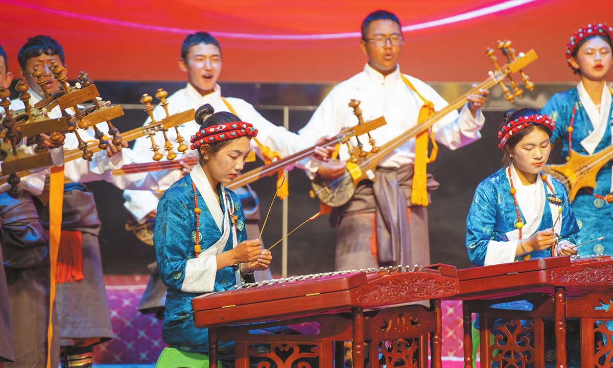 Students of a local middle school are performing ethnic musical instruments in Xigaze, China's Xizang Autonomous Region, on June 21, 2023. Photo: VCG