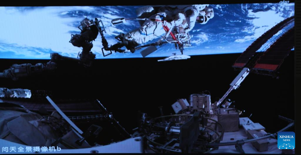 This screen image captured at Beijing Aerospace Control Center on Aug. 15, 2025 shows Shenzhou-20 astronaut Chen Dong performing extravehicular activities outside China's orbiting space station. The Shenzhou-20 crew aboard China's orbiting space station completed their mission's third series of extravehicular activities on Friday, according to the China Manned Space Agency (CMSA).(Xinhua/Li Yanchen)