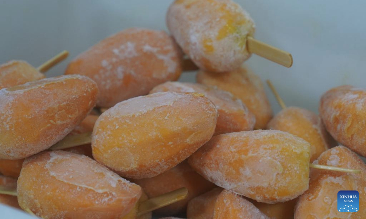 Mango-flavored ice pops are pictured at a mango processing company in Tiandong County of Baise, south China's Guangxi Zhuang Autonomous Region, July 23, 2025. (Xinhua/Zhao Huan)
