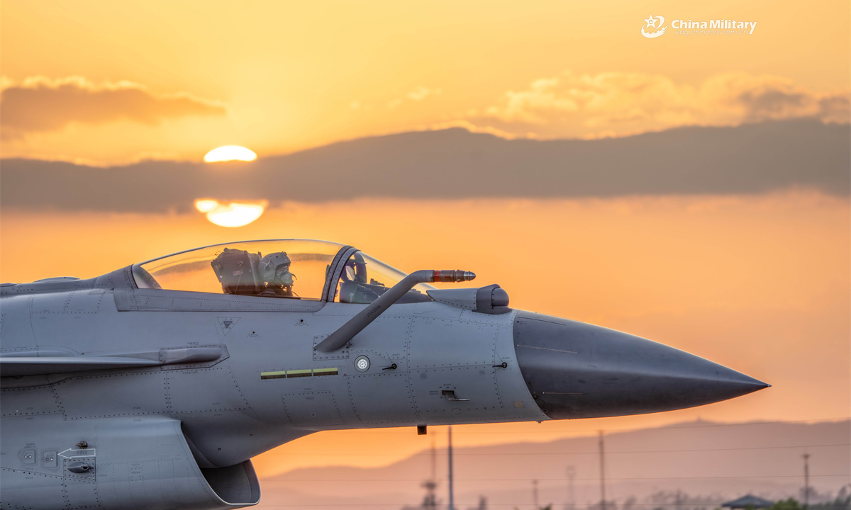 A pilot assigned to an aviation unit with the air force under the Chinese PLA Southern Theater Command guides his J-10 fighter jet down the runway during pre-flight taxi. (eng.chinamil.com.cn/Photo by Wang Guoyun)