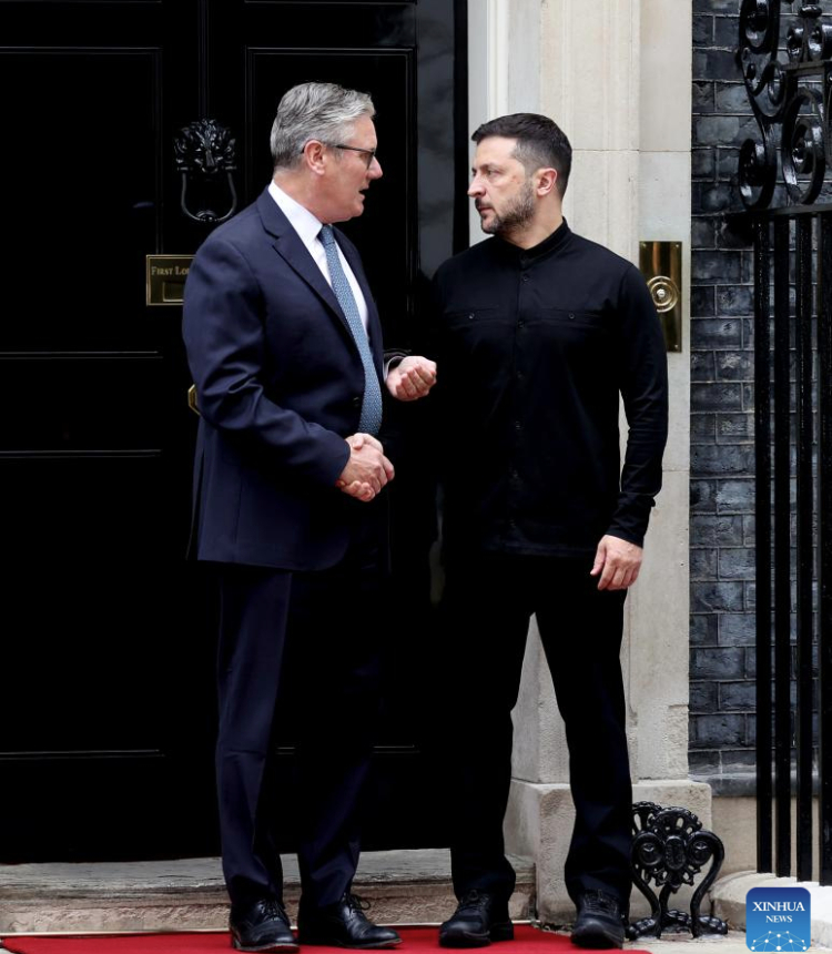 British Prime Minister Keir Starmer (L) shakes hands with Ukrainian President Volodymyr Zelensky at 10 Downing Street in London, Britain, on Aug. 14, 2025. (Xinhua/Li Ying)