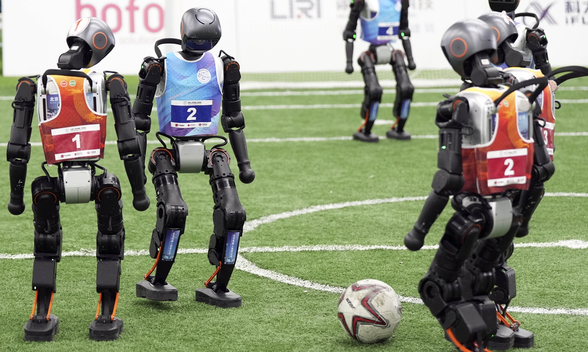 Robots take part in the Day 2 qualifiers for the football event at the 2025 World Humanoid Robot Games in Beijing's National Speed Skating Oval on August 12, 2025. The WHRC will take place from August 15 to 17. Photo: VCG