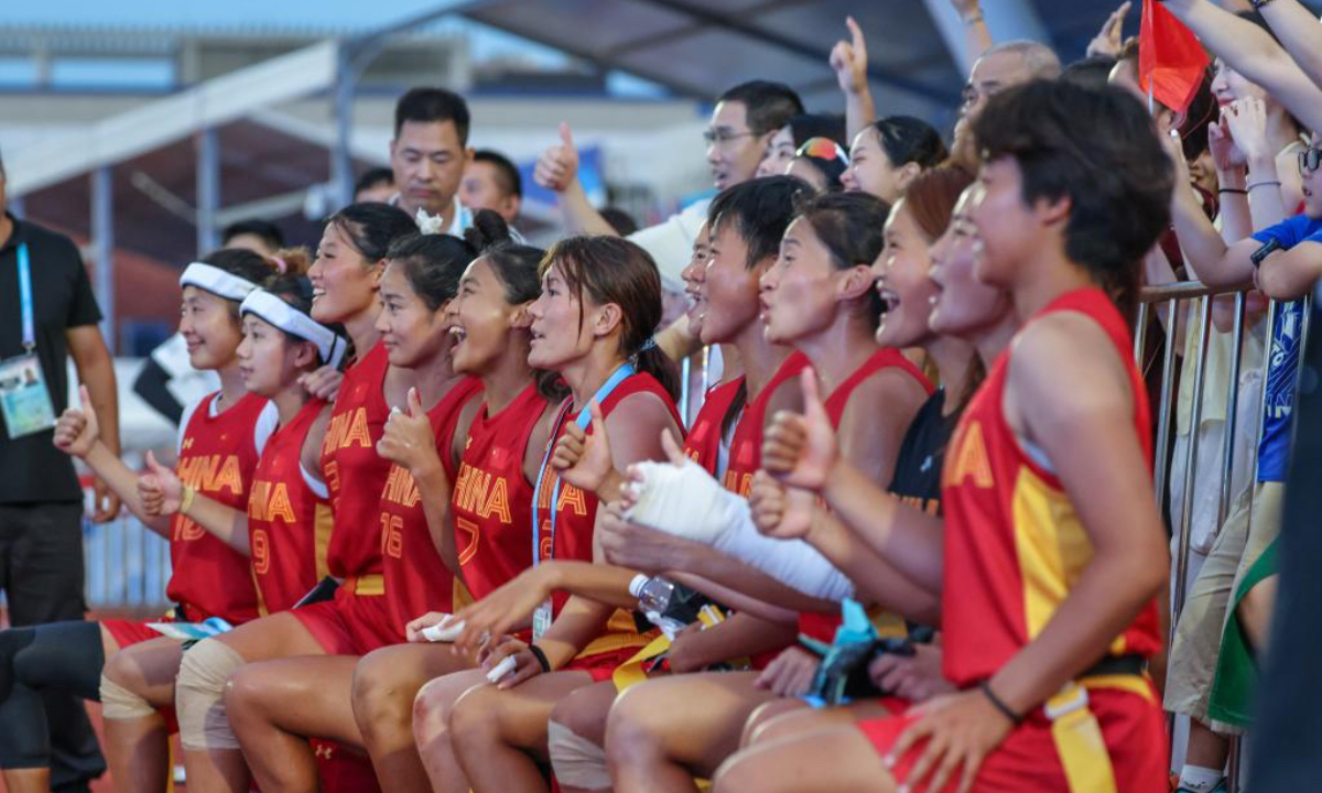 China players pose with spectators after the flag football women's 5th-8th game against Japan at the 2025 World Games in Chengdu, southwest China's Sichuan Province, Aug. 16, 2025. (Xinhua/Wei Xiang)