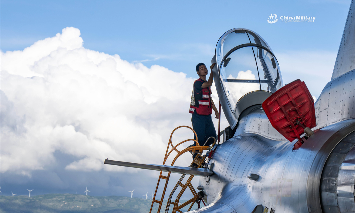 A maintenance man assigned to an aviation unit with the air force under the Chinese PLA Southern Theater Command conducts pre-flight inspections on a J-10 fighter jet during a flight training exercise. (eng.chinamil.com.cn/Photo by Wang Guoyun)