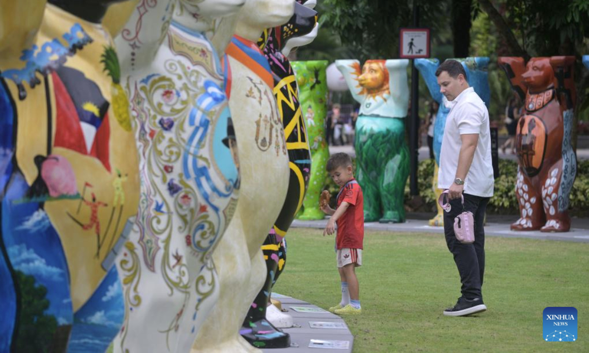 People view the life-size bears of United Buddy Bears exhibition at the Singapore's Gardens by the Bay on Aug. 14, 2025. (Photo by Then Chih Wey/Xinhua)
