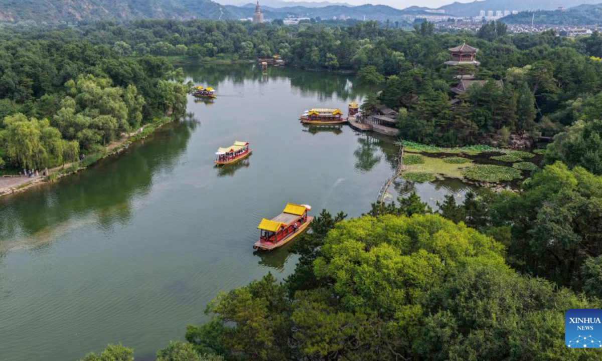 An aerial drone photo taken on Aug. 12, 2025 shows a view of the Imperial Summer Resort in Chengde, north China's Hebei Province. People enjoy their summer time by travelling around the country. (Photo by Liu Mancang/Xinhua)