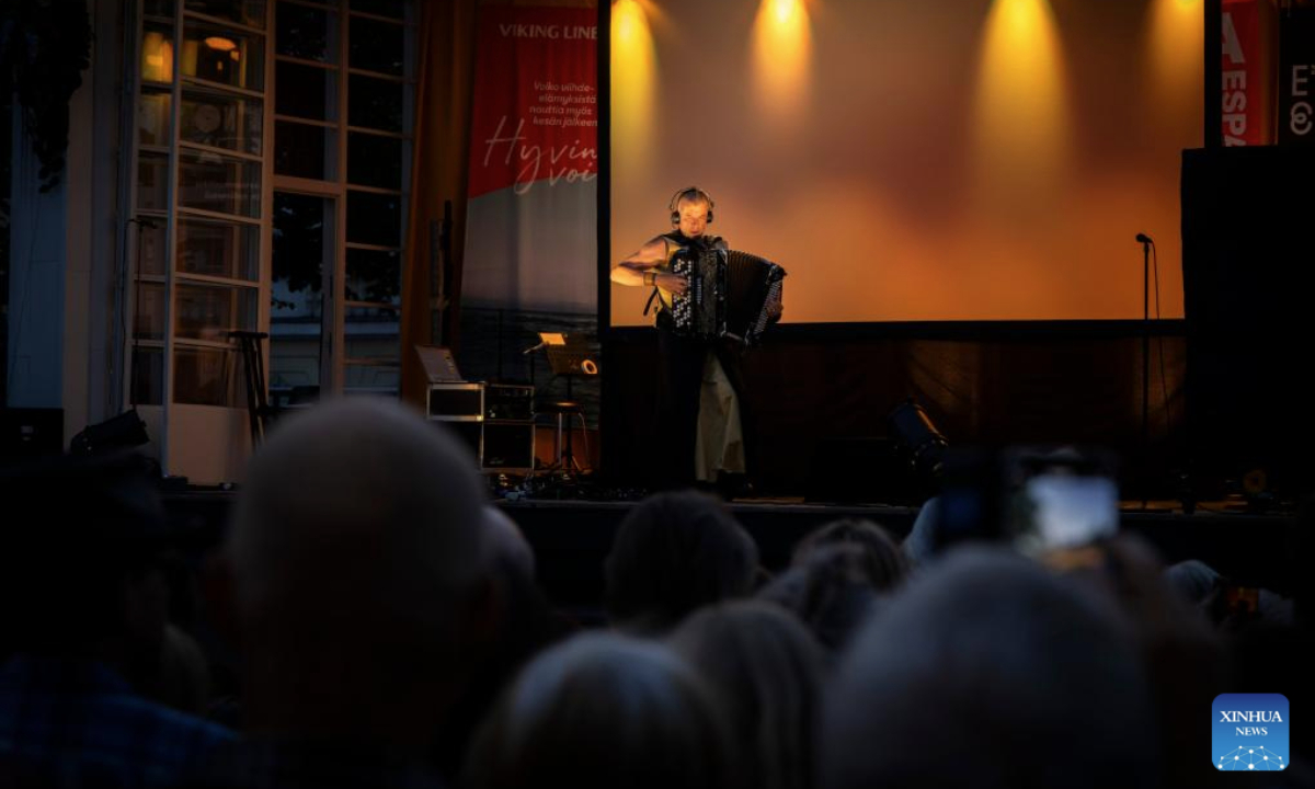 A performer plays the accordion on stage during the Night of the Arts in Helsinki, Finland, Aug. 14, 2025. The event was held here on Thursday, featuring more than 370 free art and cultural activities, including music, dance, theater, painting, literature and other art forms. (Photo by Matti Matikainen/Xinhua)