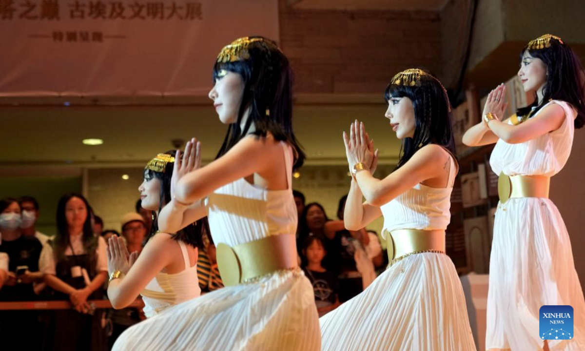 Artists perfom an Egyptian-style dance at the Shanghai Museum at night in Shanghai, east China, Aug. 11, 2025. The exhibition, titled On Top of the Pyramid: The Civilization of Ancient Egypt, opens 24 hours a day from Aug. 11 to 17 at the Shanghai Museum. During the 168-hour carnival, there will also be new books releases, Egyptian dancing performances, interactive games and cultural and creative production promotions here. (Xinhua/Liu Ying)