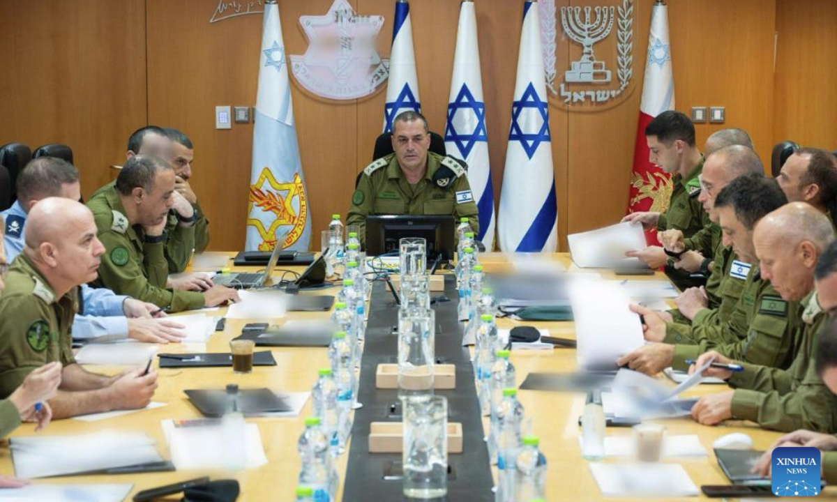 This photo released by Israel Defense Forces (IDF) on Aug. 13, 2025 shows Israel's military chief Eyal Zamir (C) attending a meeting of security officials. (IDF/Handout via Xinhua)