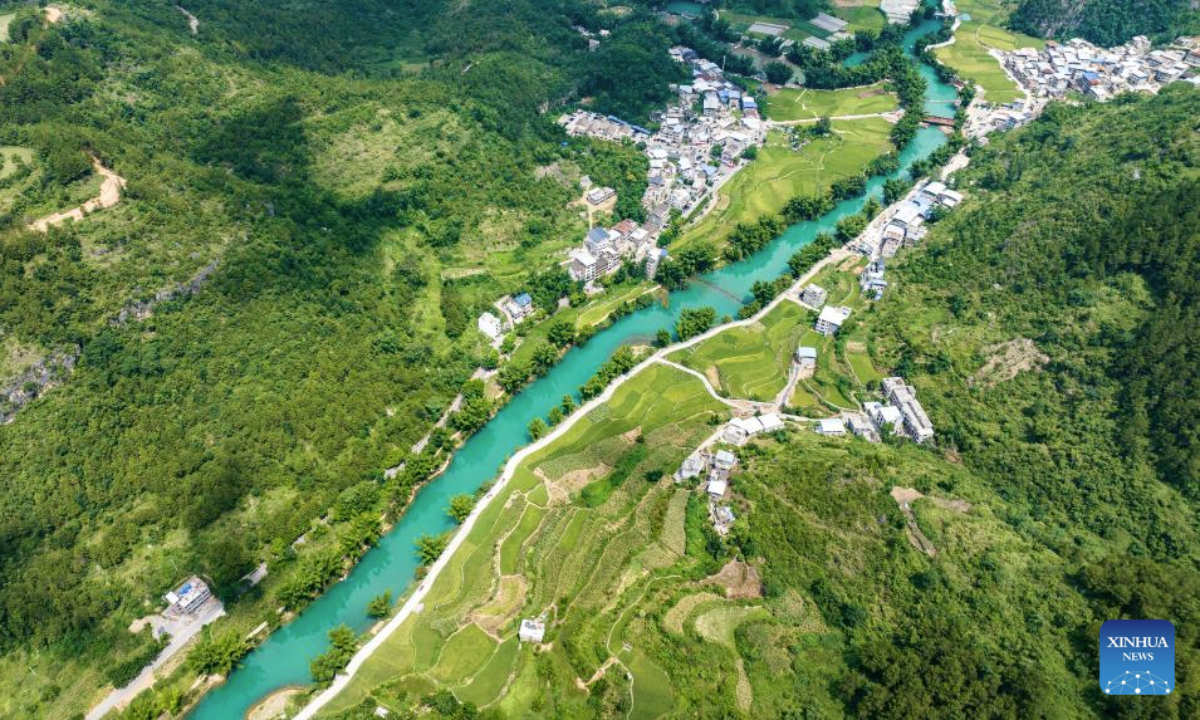 An aerial drone photo taken on Aug. 12, 2025 shows a view of the Daxiaojing scenic spot in Luodian County, southwest China's Guizhou Province. Luodian County in recent years has continuously upgraded its infrastructure and optimized its tourism service system, transforming its abundant mountain and water resources into tourist attractions. (Xinhua/Tao Liang)