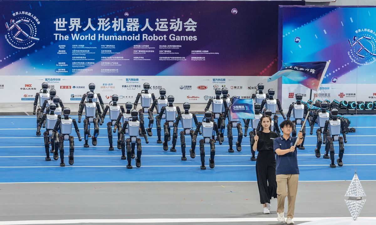 One of the robot teams appears at the opening ceremony of the 2025 World Humanoid Robot Games at the National Speed Skating Oval in Beijing on the evening of August 14, 2025. Photo: Li Hao/GT