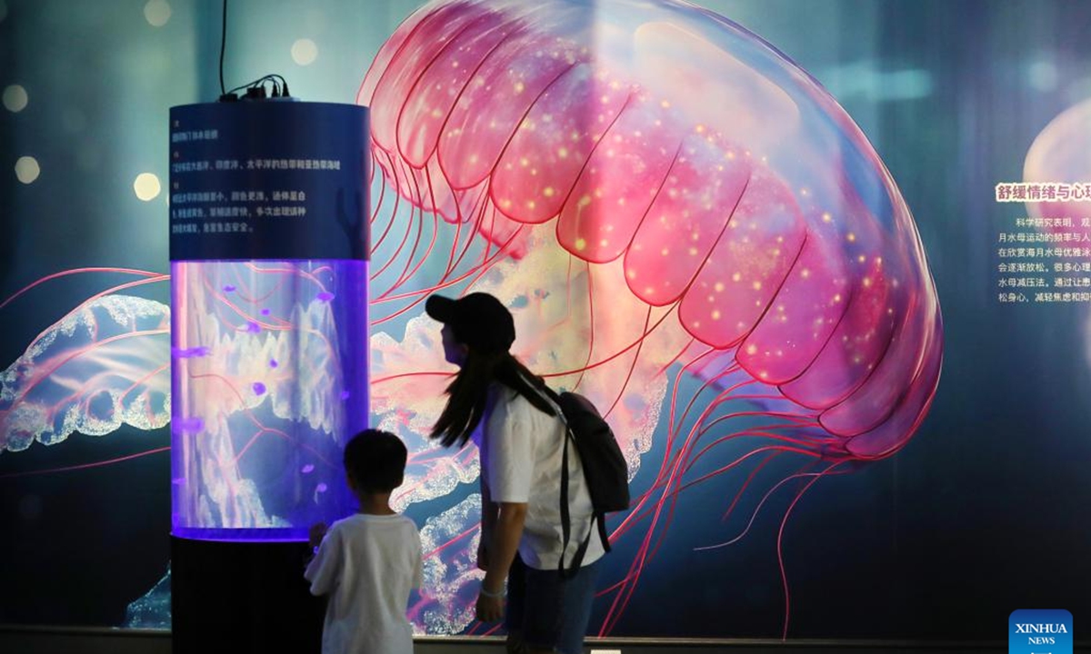 A child visits an exhibition themed on Jellyfish at a museum in Jiaxing City, east China's Zhejiang Province, Aug. 16, 2025. (Photo by Jin Peng/Xinhua)