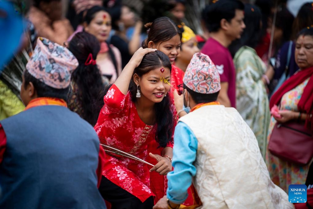 A girl receives tika during the Krishna Janmashtami festival in Lalitpur, Nepal, Aug. 16, 2025. (Photo by Hari Maharjan/Xinhua)